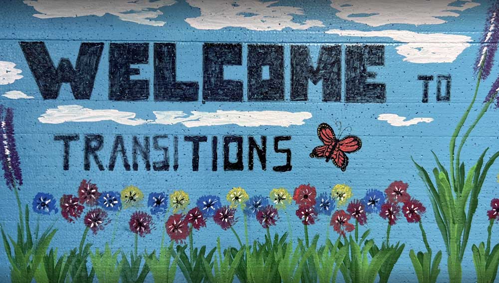 mural on wall with flowers and butterflies